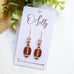 Gold Football Dangle Earrings with Cubic Zirconia Accent “Blitz”